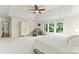 Bright main bedroom features a comfortable seating area, large windows, and plush carpet at 5310 Addington Ct, Charlotte, NC 28277