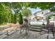 This backyard patio offers a relaxing outdoor living space with a pool in the background at 5723 Lindley Crescent Dr, Indian Trail, NC 28079
