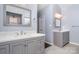 Bright bathroom with updated dual vanities, light gray cabinets, and modern fixtures at 5723 Lindley Crescent Dr, Indian Trail, NC 28079
