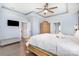 A charming bedroom with a ceiling fan, television, and decorative wooden furnishings at 5723 Lindley Crescent Dr, Indian Trail, NC 28079