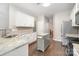 Well-lit kitchen with granite countertops, stainless steel appliances, and an island at 5723 Lindley Crescent Dr, Indian Trail, NC 28079