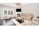 Bright living room with fireplace, large windows, and comfortable seating at 5723 Lindley Crescent Dr, Indian Trail, NC 28079