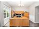 Bright office features a large desk, built-in storage, and a sun-filled window at 5723 Lindley Crescent Dr, Indian Trail, NC 28079