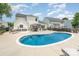 Backyard features a refreshing pool, lounge seating, and patio area perfect for outdoor entertaining at 5723 Lindley Crescent Dr, Indian Trail, NC 28079