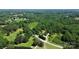 An aerial view showcases this charming home, nestled on a sprawling lot with mature trees at 604 Ferguson Ridge Rd, Gastonia, NC 28052