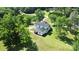 An aerial perspective showcases this charming two-story home, nestled on a well-manicured lawn with mature trees at 604 Ferguson Ridge Rd, Gastonia, NC 28052