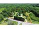 An aerial view showcases property lines of this charming home, nestled on a sprawling lot with mature trees at 604 Ferguson Ridge Rd, Gastonia, NC 28052