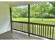 View from the back porch showing the backyard with large trees at 604 Ferguson Ridge Rd, Gastonia, NC 28052