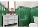 Half bath features green board and batten, and a modern vanity with a marble countertop at 604 Ferguson Ridge Rd, Gastonia, NC 28052