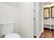 Cozy bathroom featuring a toilet and a peek into the vanity and shower space at 604 Ferguson Ridge Rd, Gastonia, NC 28052