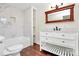 Bright bathroom boasts a shower/tub, marble tile surround, and a white vanity with drawers at 604 Ferguson Ridge Rd, Gastonia, NC 28052