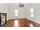 Spacious bedroom with hardwood flooring, natural light, and a beautiful decorative fireplace at 604 Ferguson Ridge Rd, Gastonia, NC 28052