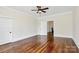 Neutral bedroom with paneled ceiling, hardwood floors and access to an adjacent room at 604 Ferguson Ridge Rd, Gastonia, NC 28052