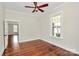 Charming bedroom featuring hardwood floors, and a sun-filled window with views of the property at 604 Ferguson Ridge Rd, Gastonia, NC 28052