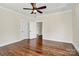 Sun-filled bedroom with hardwood floors, paneled ceiling and access to an adjacent room at 604 Ferguson Ridge Rd, Gastonia, NC 28052