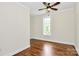 Bright bedroom with hardwood floors, a ceiling fan, and a window at 604 Ferguson Ridge Rd, Gastonia, NC 28052