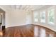 Bright dining room featuring hardwood floors, elegant chandelier, and large windows at 604 Ferguson Ridge Rd, Gastonia, NC 28052