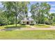 Charming white home with a circular driveway and mature trees at 604 Ferguson Ridge Rd, Gastonia, NC 28052