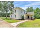 Charming two-story home with inviting porch, mature trees and landscaped yard at 604 Ferguson Ridge Rd, Gastonia, NC 28052