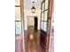 Welcoming foyer with hardwood floors, stylish light fixture, and a view of the staircase at 604 Ferguson Ridge Rd, Gastonia, NC 28052