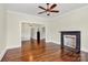 Cozy living room with hardwood floors, fireplace, and opening into another room at 604 Ferguson Ridge Rd, Gastonia, NC 28052