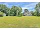 Wide shot of the home with the surrounding property and large lawn at 604 Ferguson Ridge Rd, Gastonia, NC 28052