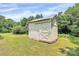 Exterior view of a shed with cream siding and a sliding door at 604 Ferguson Ridge Rd, Gastonia, NC 28052