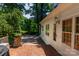 Cozy backyard patio with brick flooring and outdoor seating, perfect for enjoying the serene outdoors at 613 E Ridge St, Kings Mountain, NC 28086