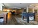 Spacious basement with wood floors, table tennis and foosball, perfect for recreation and relaxation at 613 E Ridge St, Kings Mountain, NC 28086