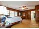 Bedroom featuring hardwood floors, paneled walls, and an inviting atmosphere, capturing classic charm at 613 E Ridge St, Kings Mountain, NC 28086