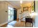 Inviting foyer with hardwood floors, a staircase, and a charming entryway table at 613 E Ridge St, Kings Mountain, NC 28086
