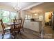 A bright, modern kitchen features updated appliances, an island, and a view to the backyard at 613 E Ridge St, Kings Mountain, NC 28086