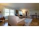The spacious living room features hardwood floors, a large window, and a cozy seating area at 613 E Ridge St, Kings Mountain, NC 28086