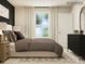 Stylish bedroom featuring a large window, decorative pillows, and modern decor for a peaceful retreat at 6316 Fairfax Ct, Maiden, NC 28650