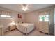Bedroom featuring a twin bed near a window with natural light and floral accents at 6416 Wilgrove Mint Hill Rd, Mint Hill, NC 28227