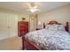 Bedroom showcasing a bed with blue floral bedding and a vintage wooden dresser at 6416 Wilgrove Mint Hill Rd, Mint Hill, NC 28227