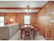 Charming dining area featuring wood-paneled walls and a classic table set at 6416 Wilgrove Mint Hill Rd, Mint Hill, NC 28227