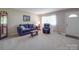 Well-lit living room with plush seating and a welcoming atmosphere at 6416 Wilgrove Mint Hill Rd, Mint Hill, NC 28227