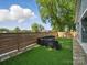 Stylish backyard features artificial grass, privacy fence, and modern outdoor seating at 708 Cross Trail Dr, Charlotte, NC 28204