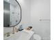 Modern bathroom features marble tiling, a large mirror, and sleek fixtures at 708 Cross Trail Dr, Charlotte, NC 28204