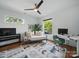 Cozy bedroom with daybed, a modern ceiling fan, and a dedicated desk space at 708 Cross Trail Dr, Charlotte, NC 28204