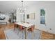 Modern dining room featuring a stylish light fixture and decorative artwork at 708 Cross Trail Dr, Charlotte, NC 28204
