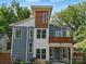 Striking modern home featuring mixed materials, a private balcony, and professionally landscaped yard at 708 Cross Trail Dr, Charlotte, NC 28204