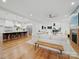 Open concept living room with a kitchen featuring a breakfast bar with seating at 708 Cross Trail Dr, Charlotte, NC 28204