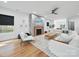 Bright and airy living room with a modern fireplace and hardwood floors at 708 Cross Trail Dr, Charlotte, NC 28204