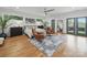 Bright, airy main bedroom with hardwood floors, large windows, and stylish furnishings at 708 Cross Trail Dr, Charlotte, NC 28204