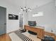 Bright office space featuring hardwood floors, modern lighting, and a large wooden desk at 708 Cross Trail Dr, Charlotte, NC 28204
