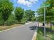 Walking path through community park with trees and landscaping at 708 Cross Trail Dr, Charlotte, NC 28204