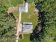Aerial view of a charming home with well-maintained lawn, mature trees, and a long driveway at 733 Killian Rd, Stanley, NC 28164