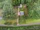 Expansive aerial view of a home with lush surrounding greenery and mature tree coverage at 733 Killian Rd, Stanley, NC 28164